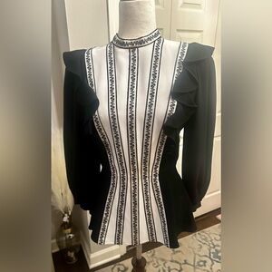 Stunning blouse.  Figure flattering.